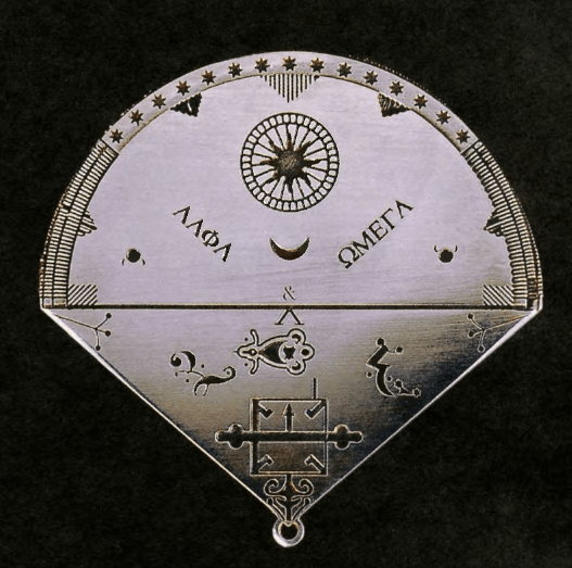 Silver triangular talisman of the Count of Saint-Germain engraved with alchemical and celestial symbols representing Alpha and Omega from the Triangular Book ritual.